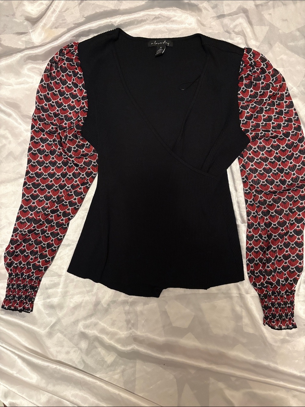 Black Wrap Ribbed Top with Red Patterned Puff Sleeves by A Love Story